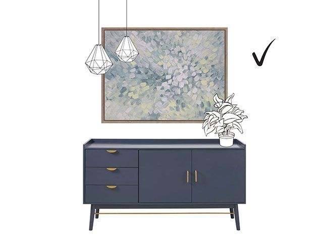 Illustration of a blue sideboard and abstract art, with lighting and a plant drawn in to show where they should be placed