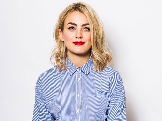 A photo of tech journalist and The Gadget Show presenter, Georgie Barrat wearing a blue and white striped shirt -living-room-goodhomesmagazine.com