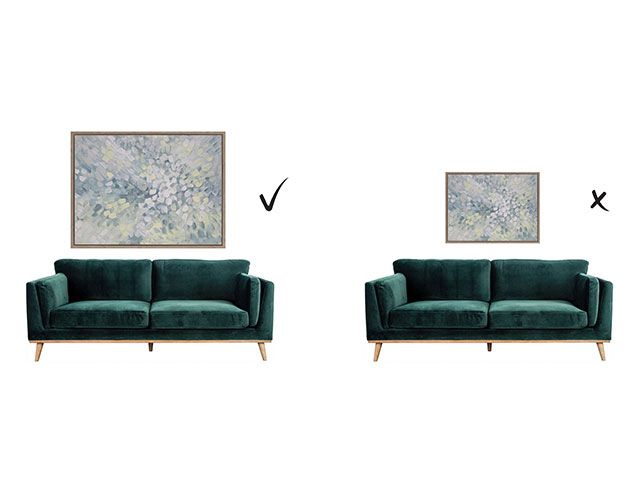 An illustration of two green sofas, one with a large print above and one with a small print above