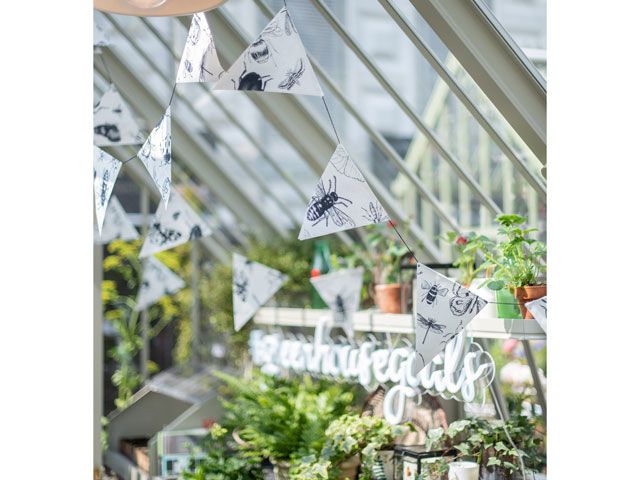 bugs hand drawn on bunting in the Alitex greenhouse styled by Selina Lake at chelsea flower show 2019