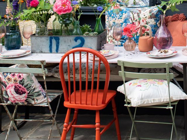 mixed dining chairs in the Alitex greenhouse styled by Selina Lake at Chelsea Flower Show 2019