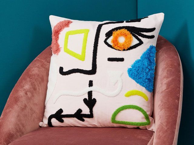 ASOS SUPPLY SS19 tufted eye cushion on a pink velvet chair