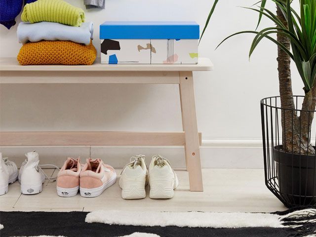 Minimal print storage box placed on storage bench with brush stroke rug underneath from asos supply - living room - goodhomesmagazine.com