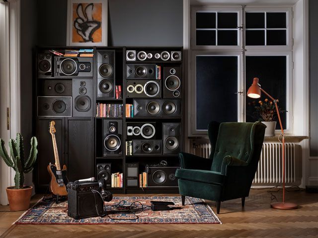 ikea billy bookcase in black housing speakers and other sound equipment in a living room in a real home