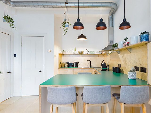 Industrial kitchen, industrial lighting, green kitchen worktop, best UK Airbnb Edunburgh.jpg