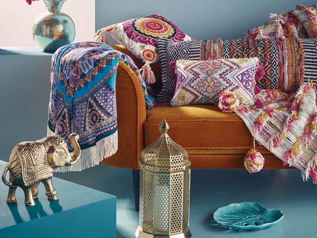 river island home ss19 collection - maximalist throws and cushions on a sofa 