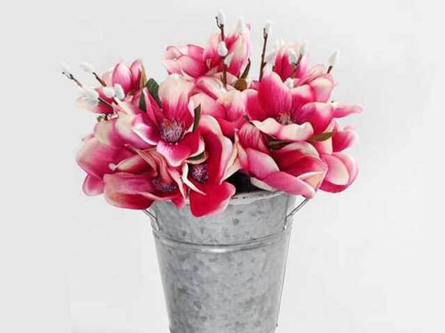 pink magnolia flowers in metal bucket - best artificial flowers - dunelm - goodhomesmagazine.com