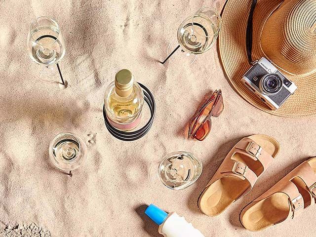 outdoor drinks holder set holding wine glasses and win bottle on beach - picnic accessories - amazon - goodhomesmagazine.com