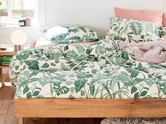 jungle leaf bed set in bright bedroom - urban outfitters