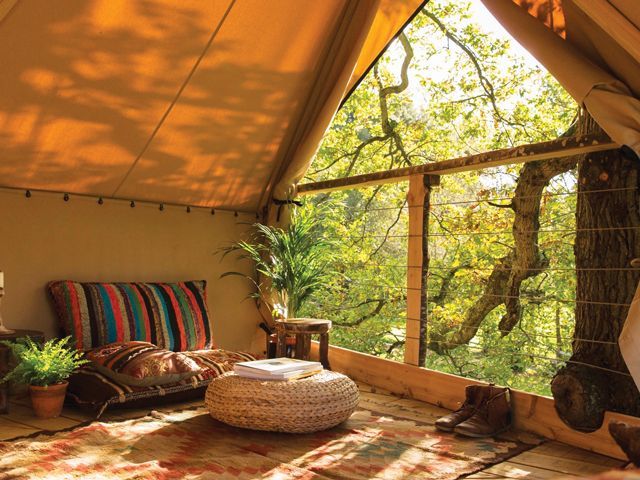 interior shot of cosy seating area in the peregrine treehouse as featured in Canopy & Stars 