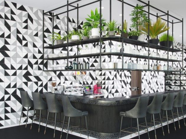 Corner bar area with counter stools and geometric wall tiles copy