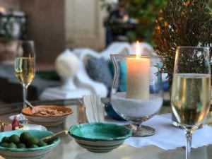 champagne or prosecco glasses at a meal on a dinner table by mel maldonado turner