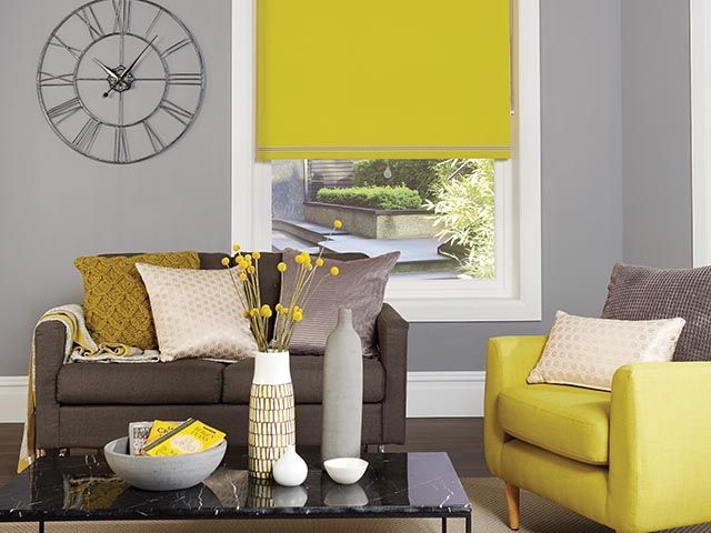 colourful yellow and grey living room - improve home and mental health - goodhomesmagazine.com