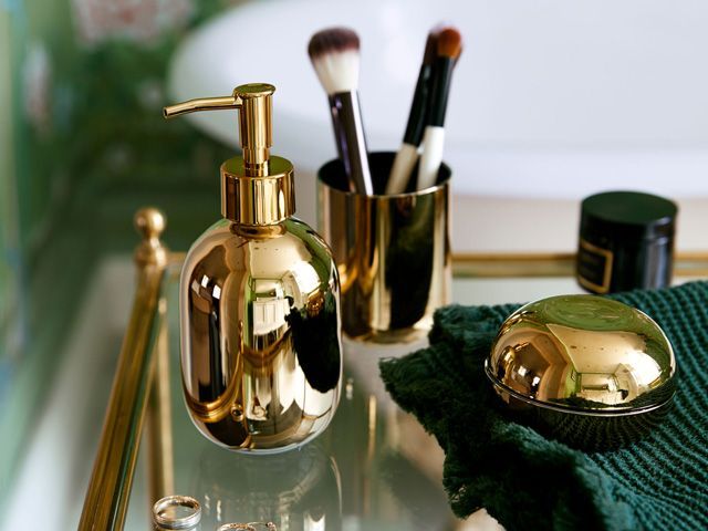 gold glass soap dispenser and other bathroom accessories from hm collection 2019 endorsed by poppy delevingne