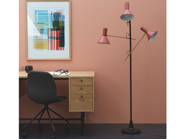 habitat nyx red floor lamp with black by a desk in a study/office