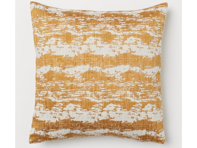 jacquard weave cushion in gold from the hm home collection 2019 endorsed by poppy delevingne