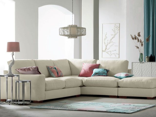 next home beige and white living room with lamps, pendant light and cream sofa