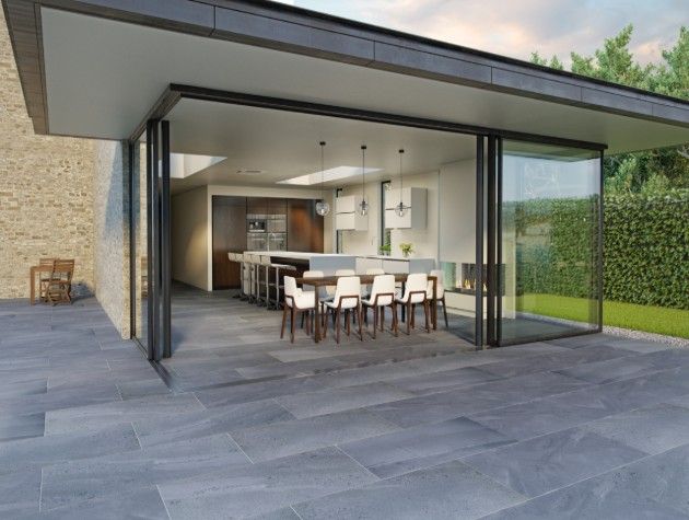 A patio leading to a kitchen and dining room through sliding doors