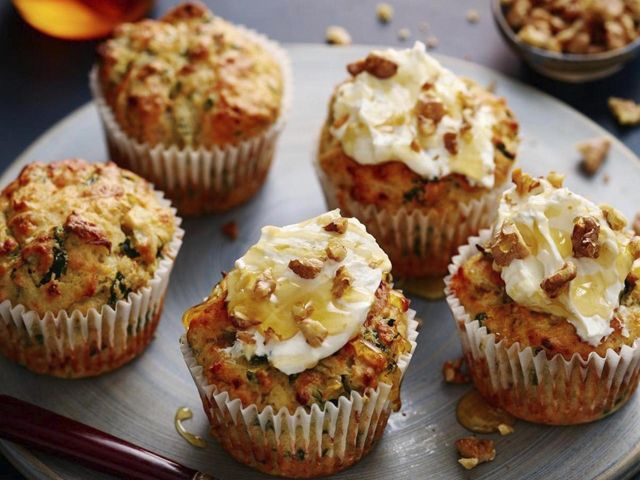 Apple walnut sage and spinach savoury muffins on a baking tray - Credit: M&S