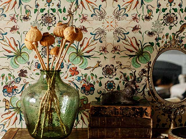 Botanical nature inspired autumn wallpaper behind shelf 