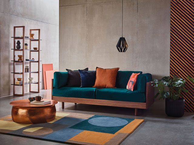 Victor green sofa in a mid century modern living room from Habitat