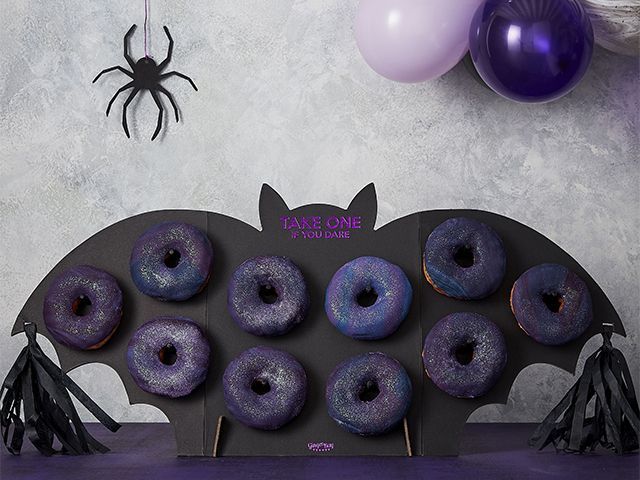 gingery ray halloween donut wall - 7 quirky halloween decorating ideas - inspiration - goodhomesmagazine.com