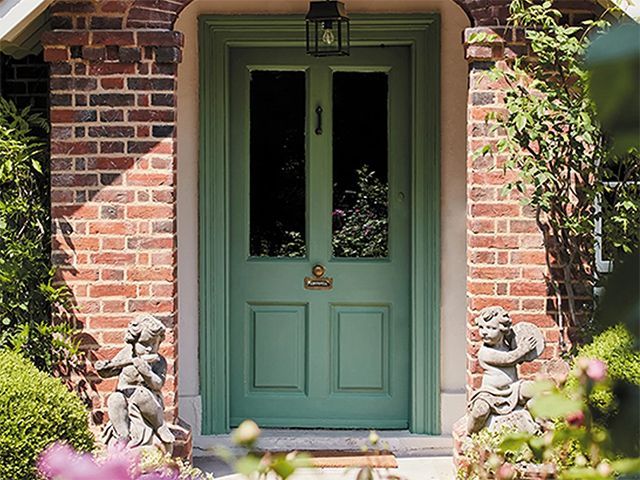Country house front door painted in Little Greene's Ho Ho Green - garden - goodhomesmagazine.com