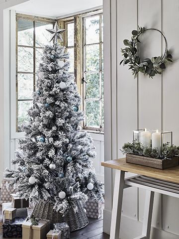 argos scandi look in a white painted wood clad living room with bay window - our top high street Christmas tree looks - inspiration - goodhomesmagazine.com