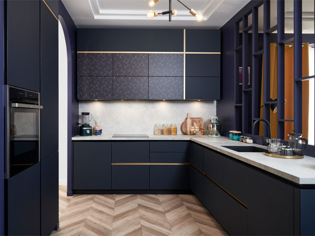 handleless kitchen with metallic trim detailing, gold and navy blue