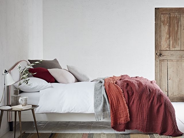 Brique linen marais throw on bed by loom and last - cosy bedroom - goodhomesmagazine.com