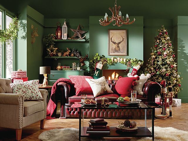 matalan traditional christmas look in a green painted living room with red sofa - our top high street Christmas tree looks - inspiration - goodhomesmagazine.com