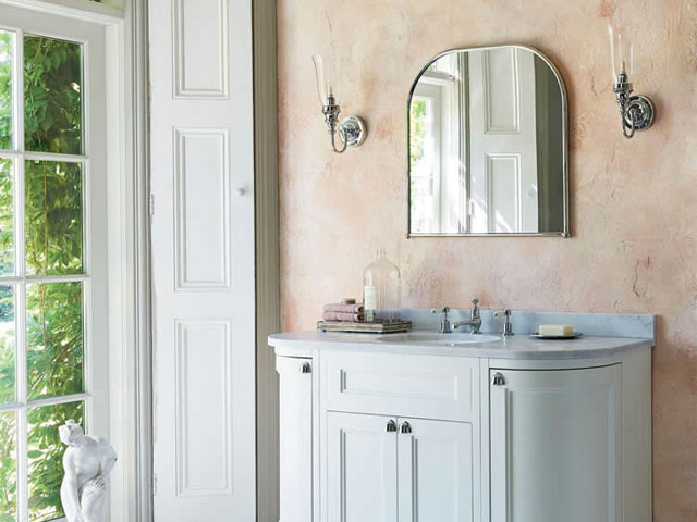 Clear vase bathroom light in light modern bathroom