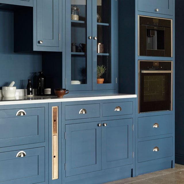 shaker-style cabinets painted in inky blue