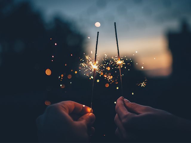 sparklers unsplash opener - how to host bonfire night - inspiration - goodhomesmagazine.com