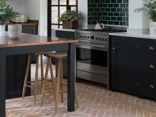 terracotta floor tiles laid in herringbone pattern