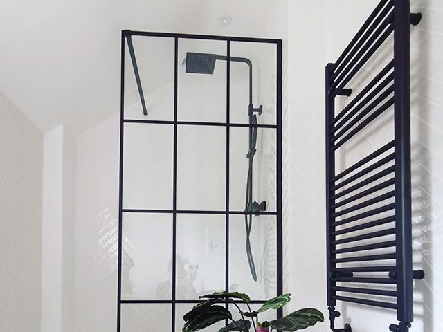 @one.3.three shower with black screen, towel rail and rainfall shower - bathroom - goodhomesmagazine.com