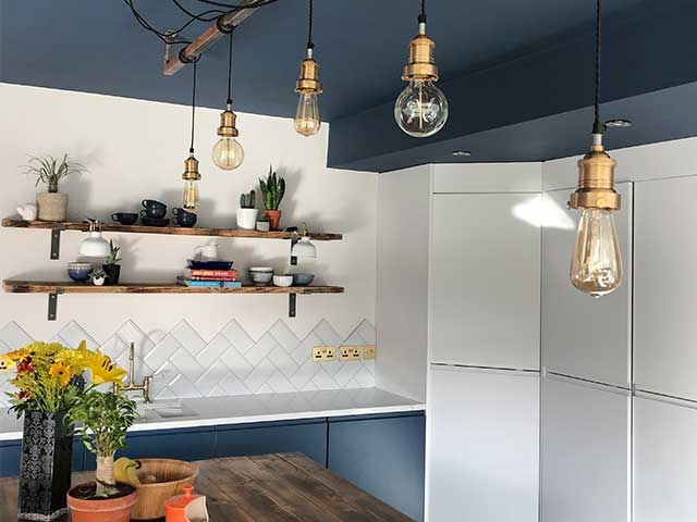 hanging lights, wooden shelves and white tiled farmhouse kitchen, goodhomesmagazine.com