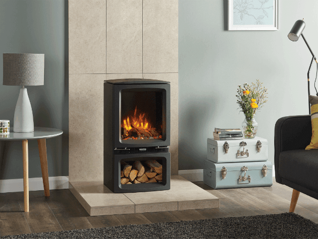 A log effect electric stove in black in a lounge