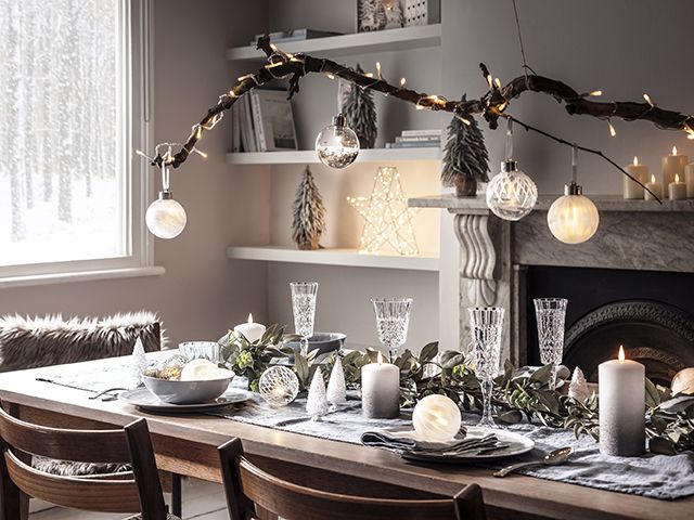 winter dining table with branch hanging - christmas - goodhomesmagazine.com