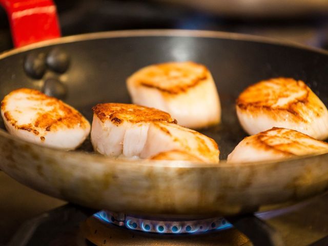 Scallops seared in pan - Credit: Jason Atherton