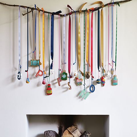 oliver bonas christmas decorations hanging from twig - goodhomesmagazine.com