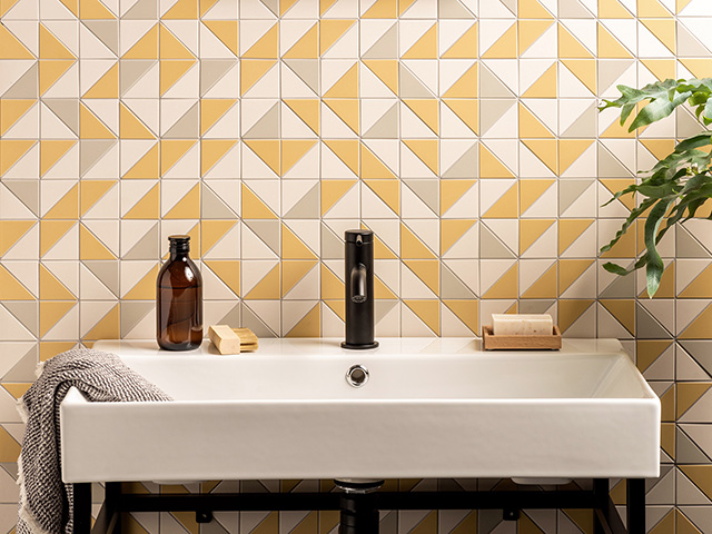 yellow and grey tiles in a bathroom - pantone colour of the year 2021 - goodhomesmagazine.com