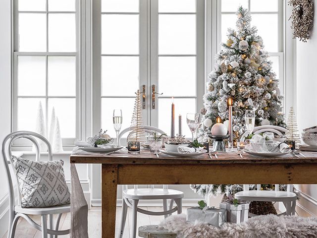 amara silver and white christmas dining table styling ideas - goodhomesmagazine.com