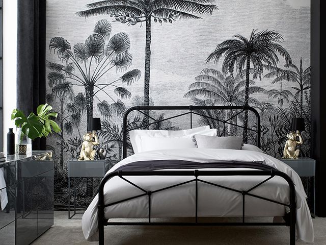 next monochrome tropical bedroom with monkey lamps - goodhomesmagazine.com