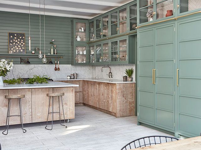 Green panelled kitchen wall with wood island - blakes london - goodhomesmagazine.com