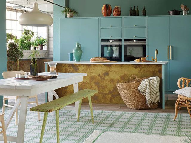 Bespoke teal kitchen with brass island and rustic furniture - bert and may - goodhomesmagazine.com