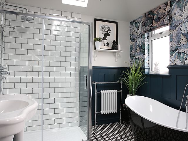 blue bathroom with wallpaper and shower - goodhomesmagazine.com