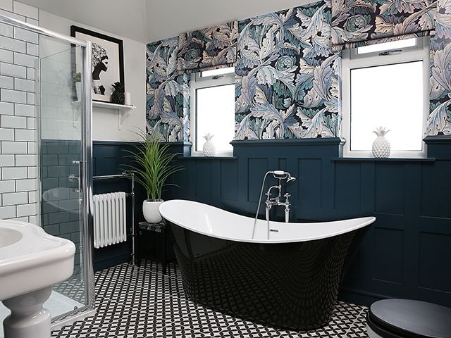 Blue bathroom with freestanding bath and wallpaper - goodhomesmagazine.com