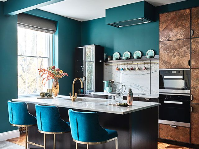 Luxury kitchen with blue and copper finishes in London apartment - home tour - goodhomesmagazine.com