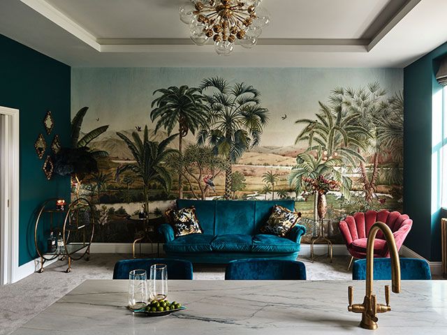 Luxury kitchen with tropical mural and velvet furnishings- goodhomesmagazine.com